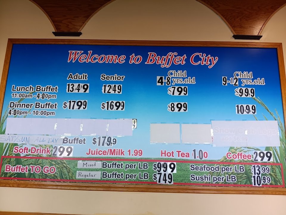 Assorted hot dishes on a buffet line